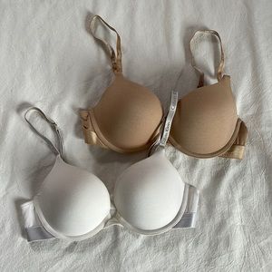 Nude and white Calvin Klein bras